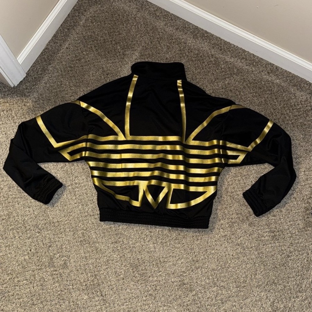 NWOT Women’s Adidas jacket with gold foil logo on back size XS